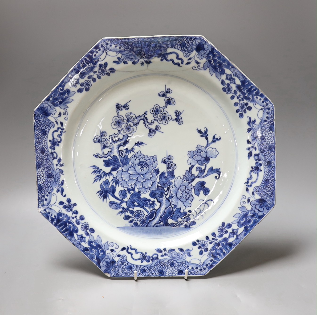 A Chinese blue and white octagonal plate with botanical decoration, together with another Chinese Imari plate with landscape decoration, 31cm diameter